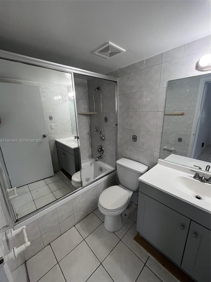 17021 North Bay Road, Unit 508 Sunny Isles Beach, FL 33160 - Photo 17 of 22 a bathroom with a sink toilet and shower