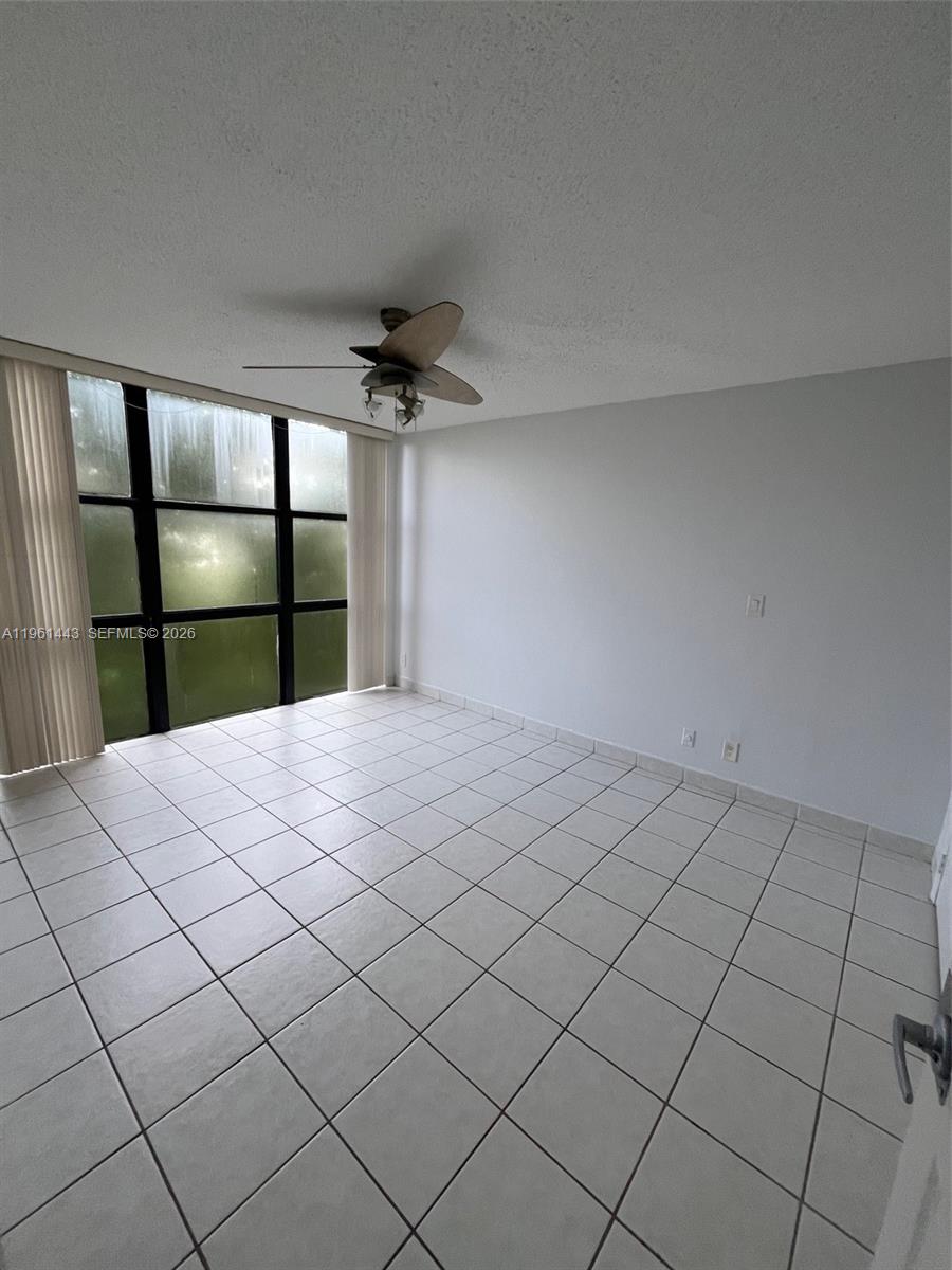 17021 North Bay Road, Unit 508 Sunny Isles Beach, FL 33160 - Photo 19 of 22 a bedroom with a bed and a window