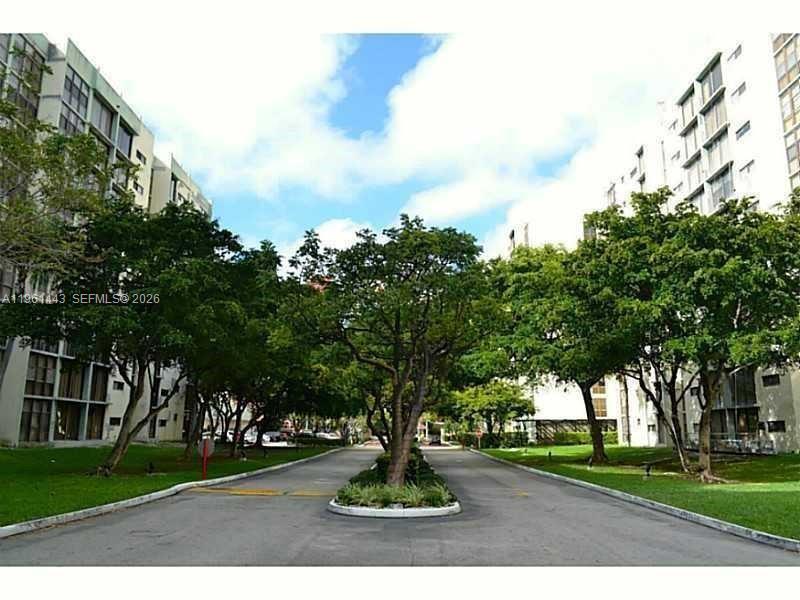 17021 North Bay Road, Unit 508 Sunny Isles Beach, FL 33160 - Photo 3 of 22 a park view with large trees