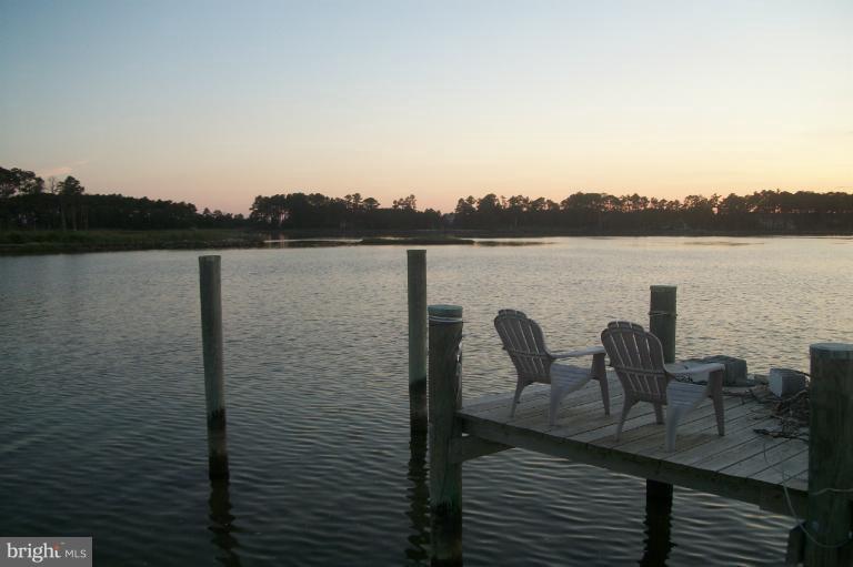 748 Hills Point Road Cambridge, MD 21613 - Photo 17 of 30 Chairs on pier for quiet enjoyment