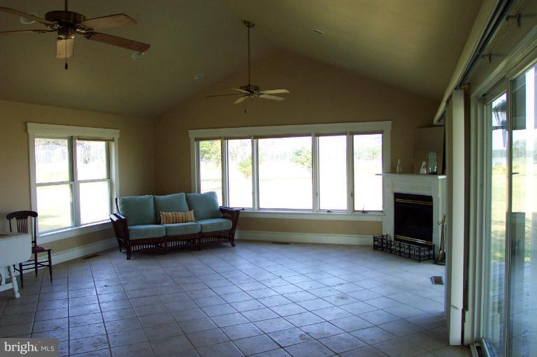 748 Hills Point Road Cambridge, MD 21613 - Photo 23 of 30 Spacious great room with fireplace