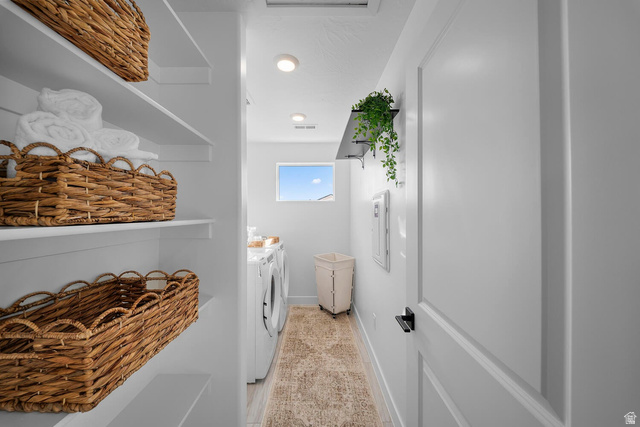 382 North Rhyolite Drive, Unit 111 Hurricane, UT 84737 - Photo 24 of 37 Utility room featuring built-in shelving, recessed lighting, and a window for natural light