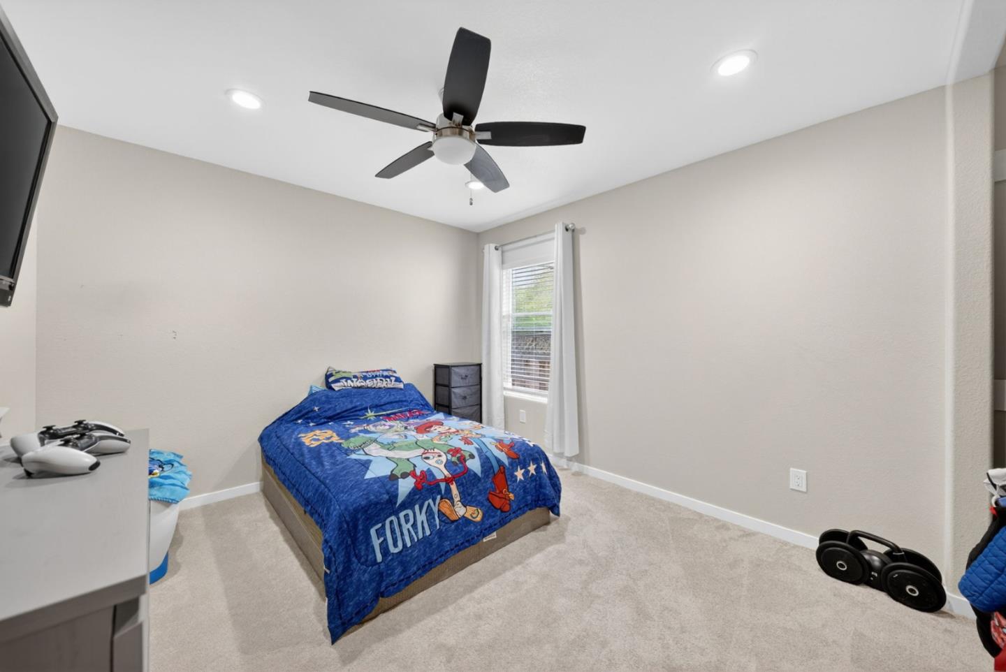 919 Old Canyon Road Fremont, CA 94536 - Photo 25 of 55 a bedroom with a bed and a ceiling fan