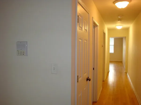 a bathroom with a shower and a glass door