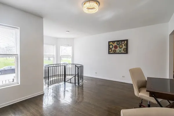 a view of a livingroom with furniture and wooden floor