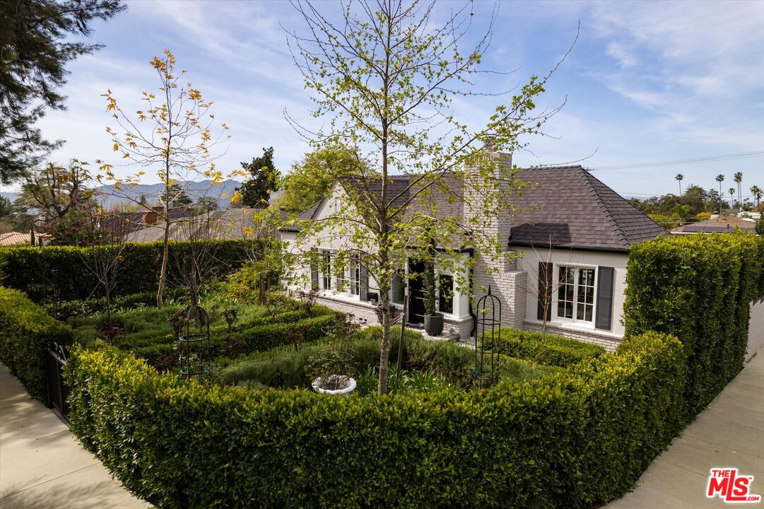 a view of a house with a garden