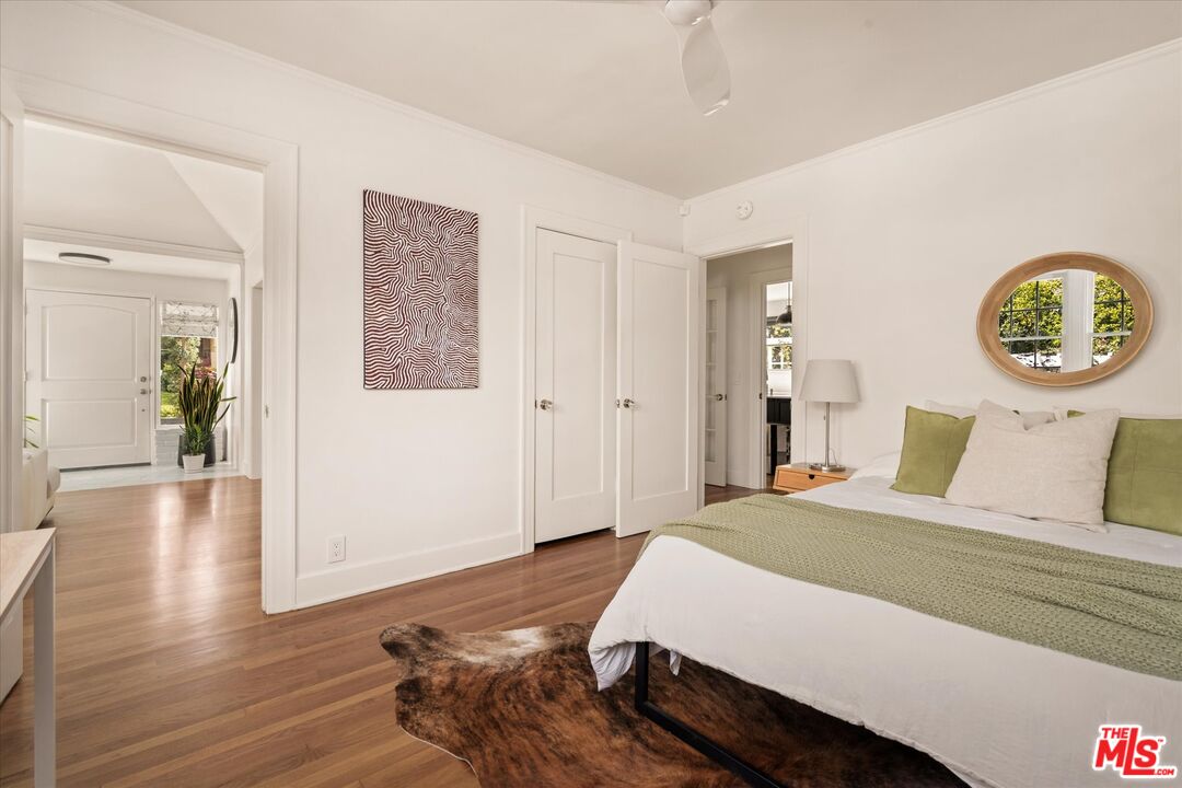 1735 Idlewood Road Glendale, CA 91202 - Photo 18 of 64 a bedroom with a bed and a painting on the wall