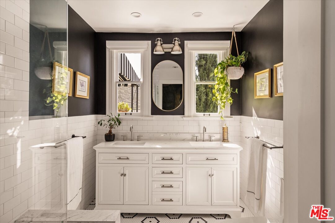 1735 Idlewood Road Glendale, CA 91202 - Photo 19 of 64 a bathroom with a double vanity sink and a mirror
