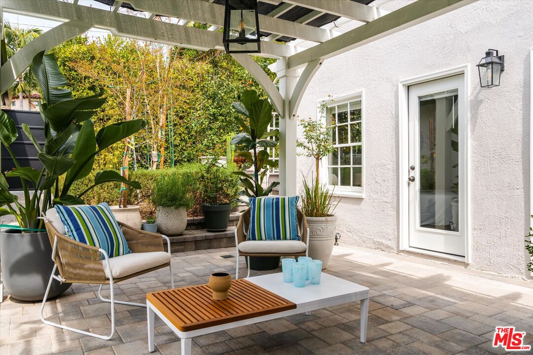 1735 Idlewood Road Glendale, CA 91202 - Photo 32 of 64 a view of a patio with couches table and chairs and potted plants