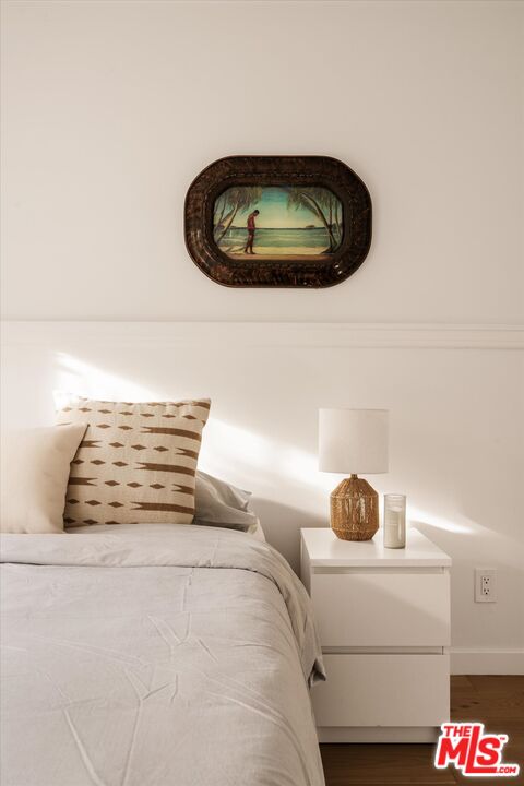 1735 Idlewood Road Glendale, CA 91202 - Photo 37 of 64 a bedroom with a bed and a painting on the wall