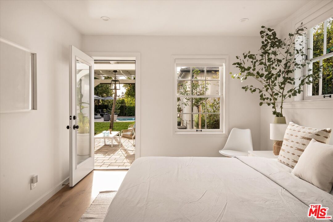 1735 Idlewood Road Glendale, CA 91202 - Photo 38 of 64 a bedroom with a large bed and a window
