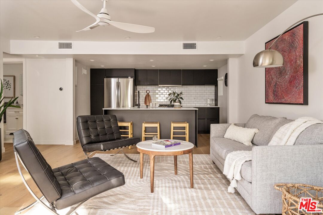 1735 Idlewood Road Glendale, CA 91202 - Photo 42 of 64 a living room with furniture and a wooden floor
