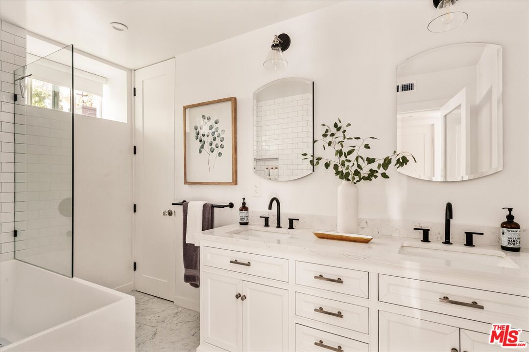 1735 Idlewood Road Glendale, CA 91202 - Photo 45 of 64 a bathroom with a double vanity sink mirror and bathtub