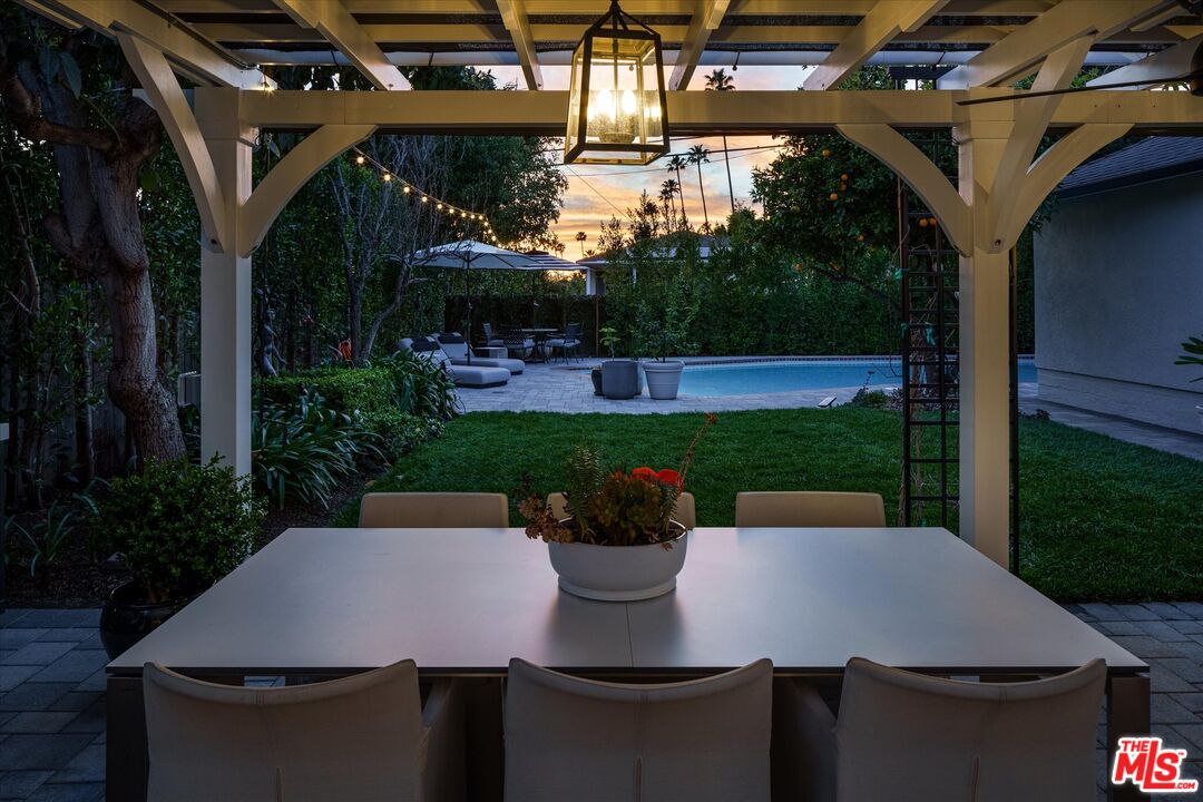 1735 Idlewood Road Glendale, CA 91202 - Photo 46 of 64 a patio with table and chairs and potted plants