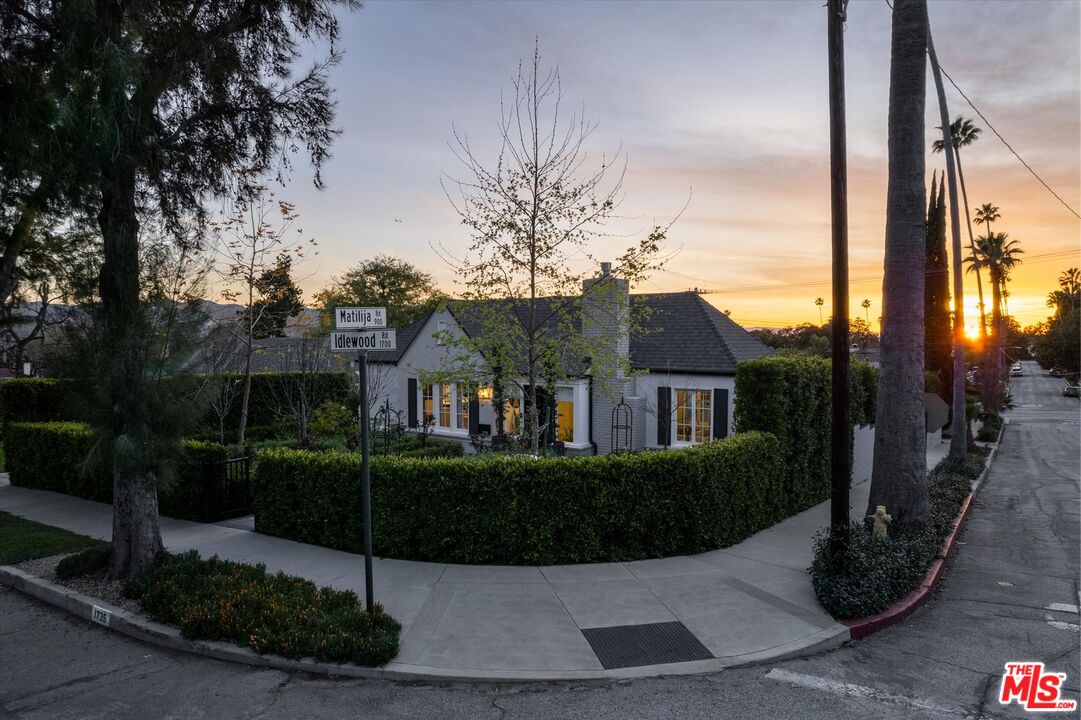 1735 Idlewood Road Glendale, CA 91202 - Photo 53 of 64 a view of a house next to a yard