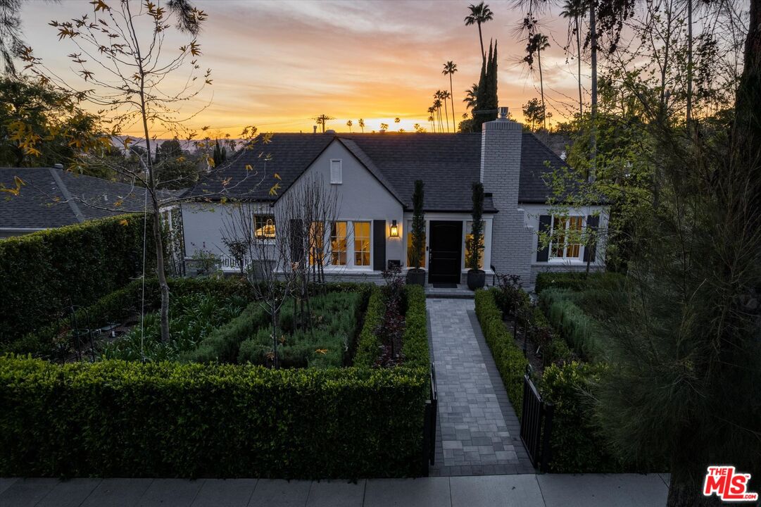 1735 Idlewood Road Glendale, CA 91202 - Photo 54 of 64 a front view of a house with garden