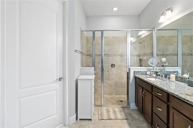 a bedroom with a bed chair and window