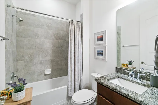 a room with furniture pool table and windows