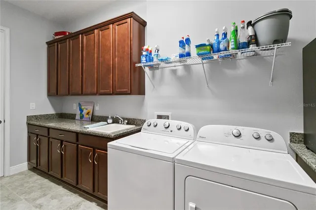 a swimming pool view with a seating space and a garden