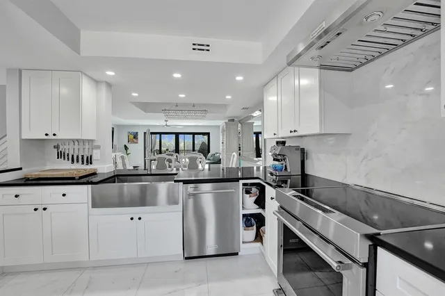 a dining room with furniture a window and kitchen view
