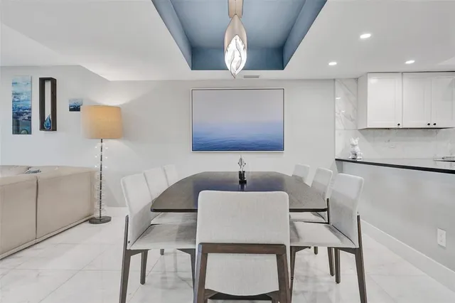 a balcony with furniture and water view