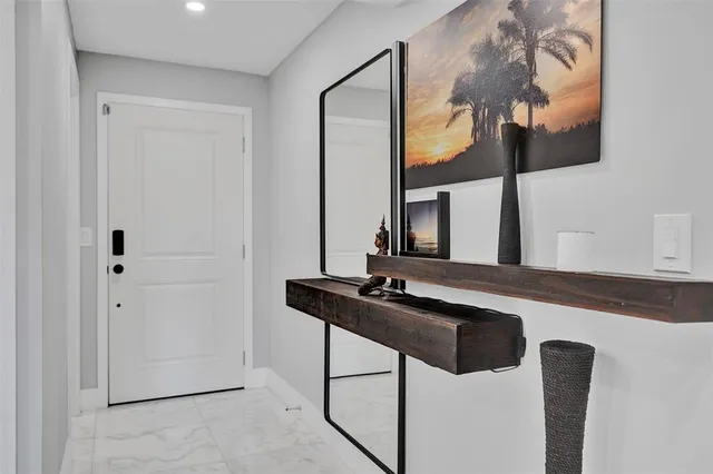 a kitchen with granite countertop cabinets stainless steel appliances and a counter space