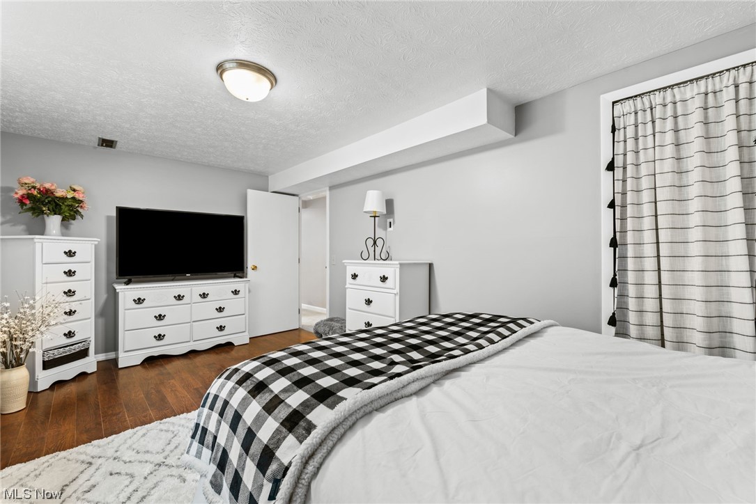 9935 Fair Road Strongsville, OH 44149 - Photo 18 of 34 Hardwood floored bedroom featuring a textured ceiling