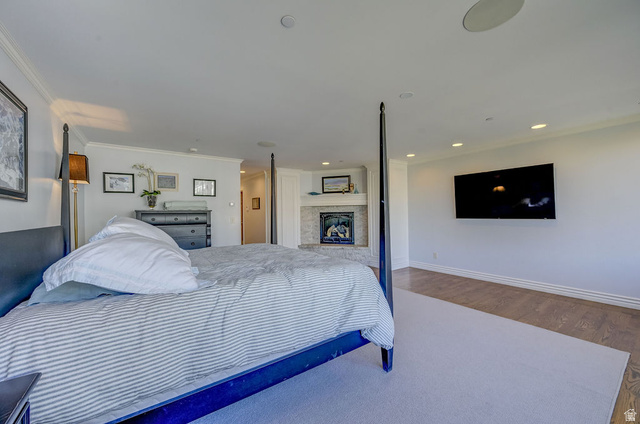 9699 Bypass Road, Unit 5 Alta, UT 84092 - Photo 44 of 54 Spacious bedroom featuring recessed lighting, a built-in fireplace with a stone surround, and crown molding