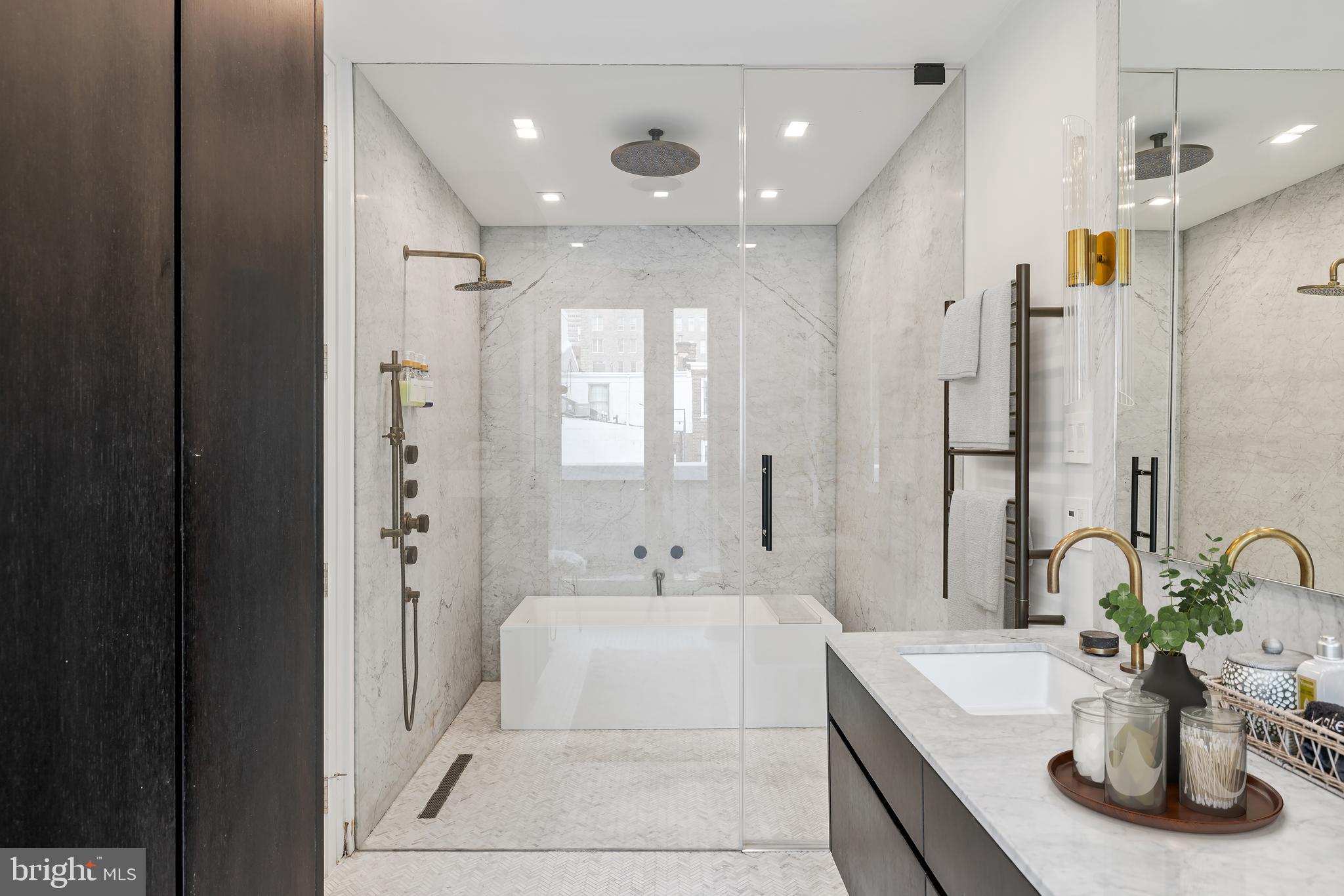 1727 Delancey Place Philadelphia, PA 19103 - Photo 18 of 35 a bathroom with a double sink shower and a mirror