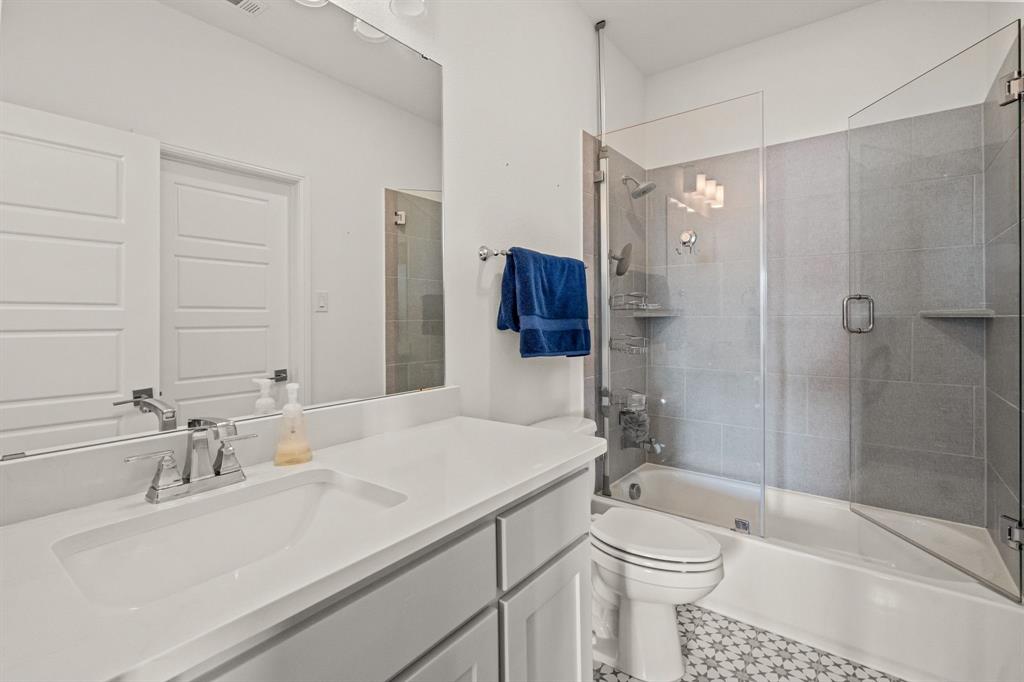 1616 Prairie Ridge Road Fort Worth, TX 76008 - Photo 33 of 40 a bathroom with a sink toilet vanity and shower