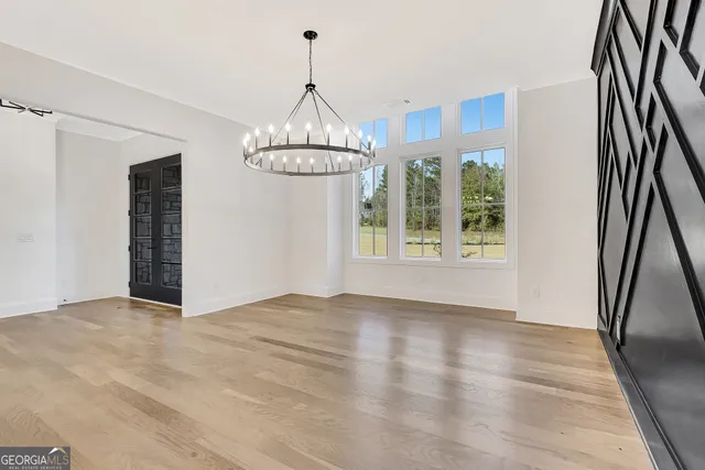 a spacious bathroom with a shower sink and mirror