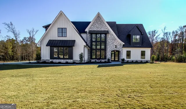 a front view of a house with swimming pool