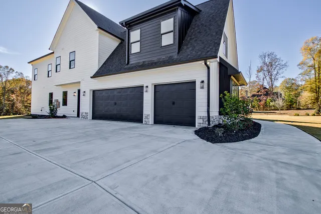 a aerial view of a house with a yard