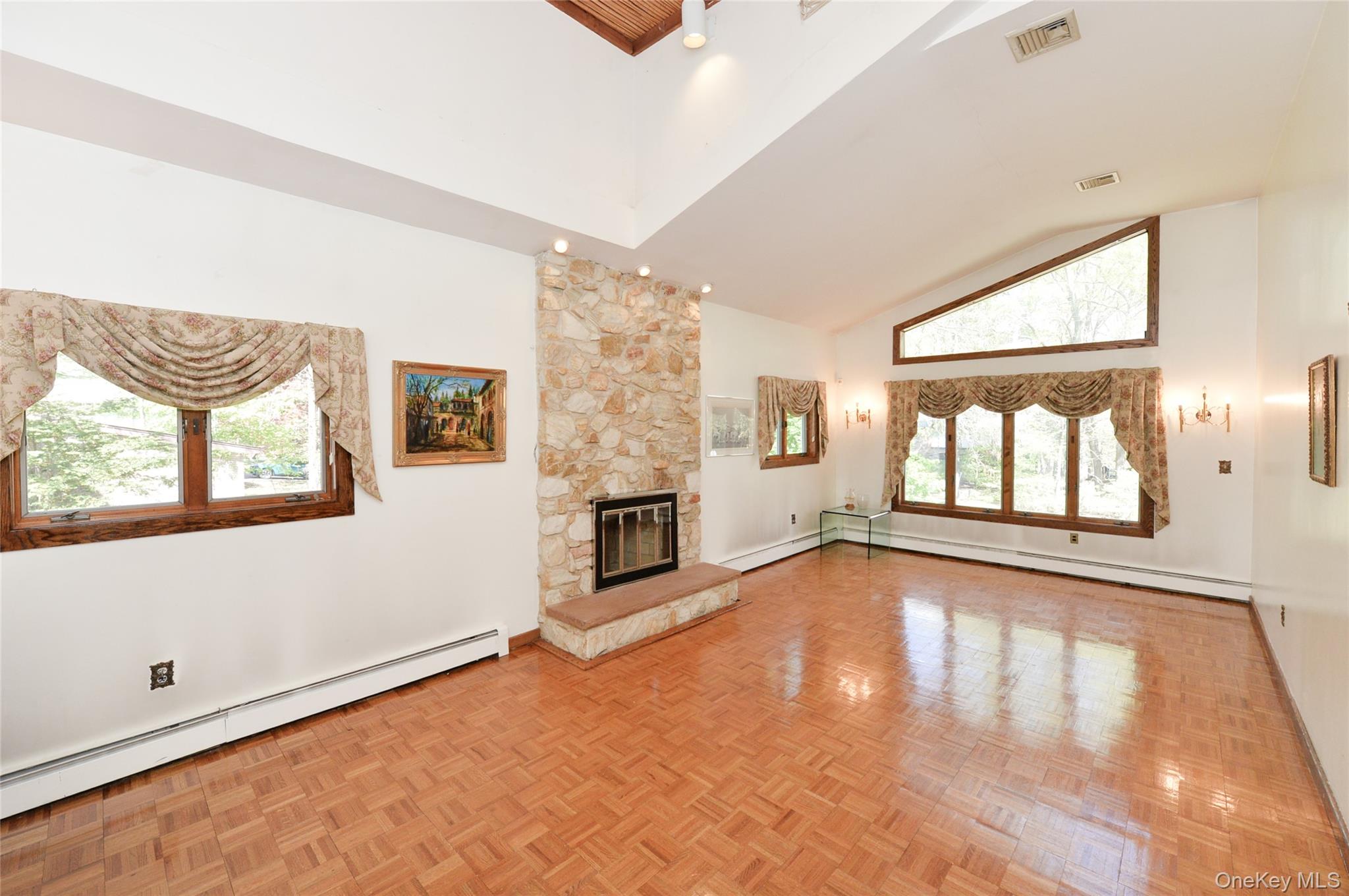 24 Highview Road Monsey, NY 10952 - Photo 7 of 44 a view of an empty room with window and fireplace