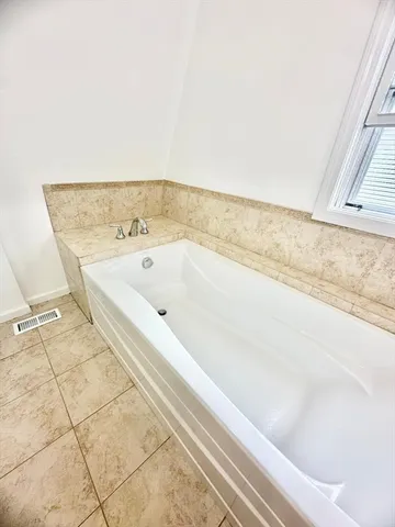 a bathroom with a sink a mirror and a shower