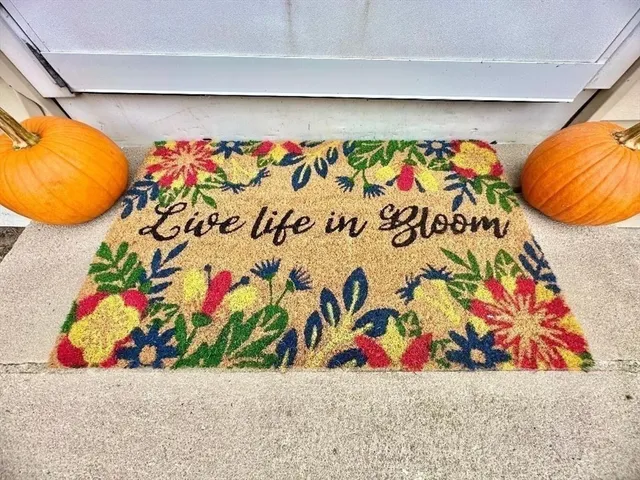 a view of a terrace with a table and chairs