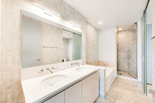 a bathroom with a bathtub and a sink