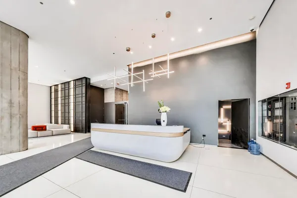 a spacious bathroom with a double vanity sink and a large mirror