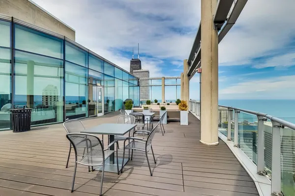 a view of balcony with furniture