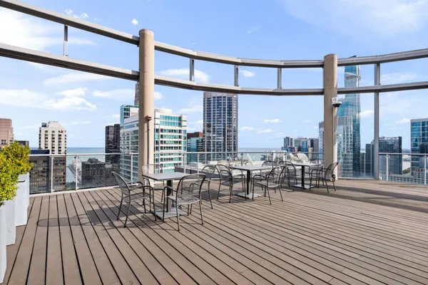 a view of roof deck with patio