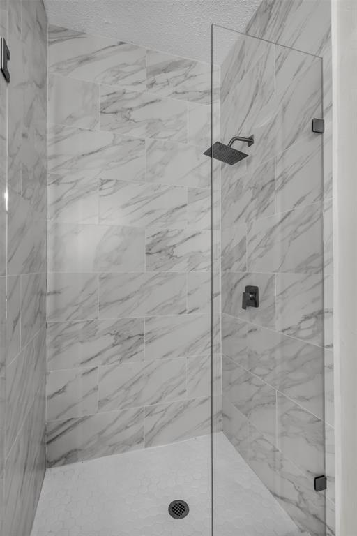 308 Glen Ridge Drive Murphy, TX 75094 - Photo 21 of 36 a bathroom with a shower