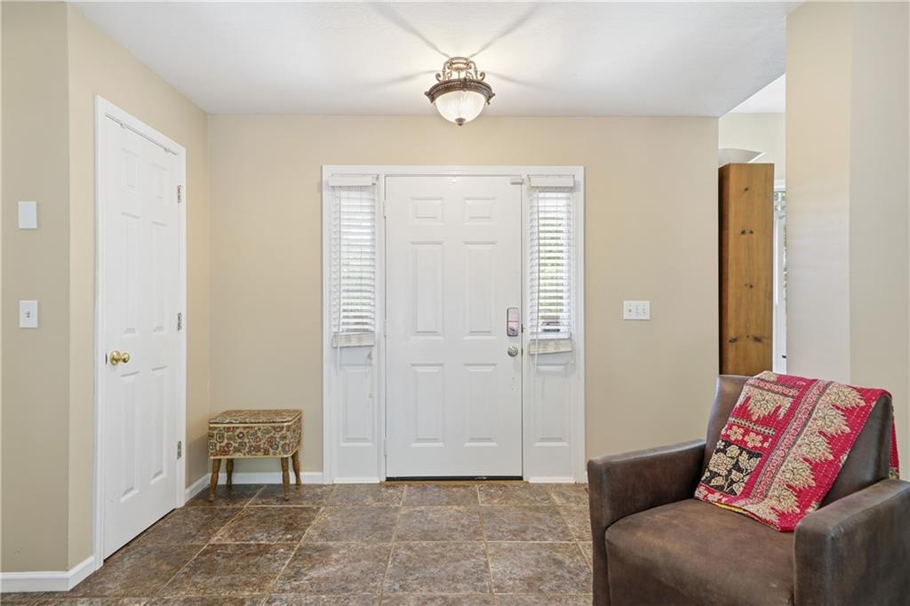 137 Orchard Way Southeast Calhoun, GA 30701 - Photo 22 of 39 a living room with furniture and a window