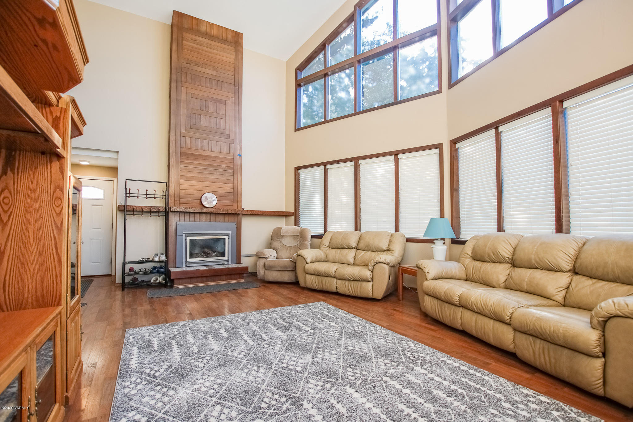 6608 Postma Road Yakima, WA 98901 - Photo 6 of 34 a living room with furniture fireplace and a large window