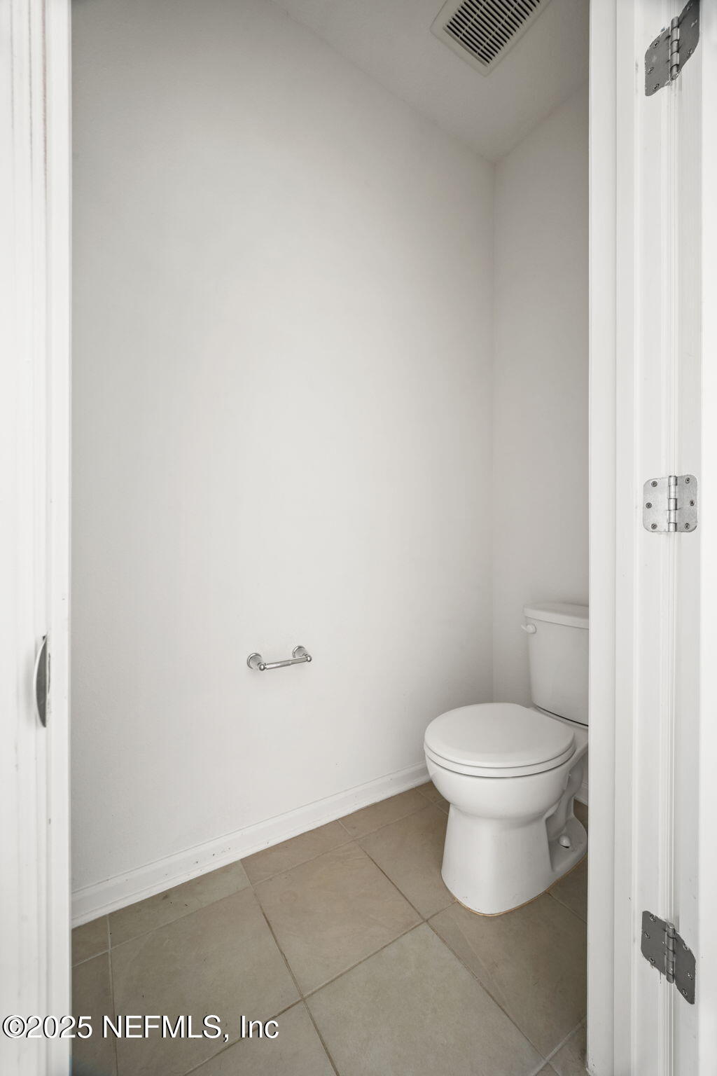 11799 Junegrass Road Jacksonville, FL 32258 - Photo 13 of 33 a white toilet sitting next to a white wall