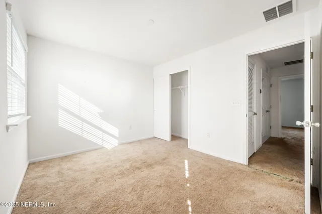 an empty room with windows