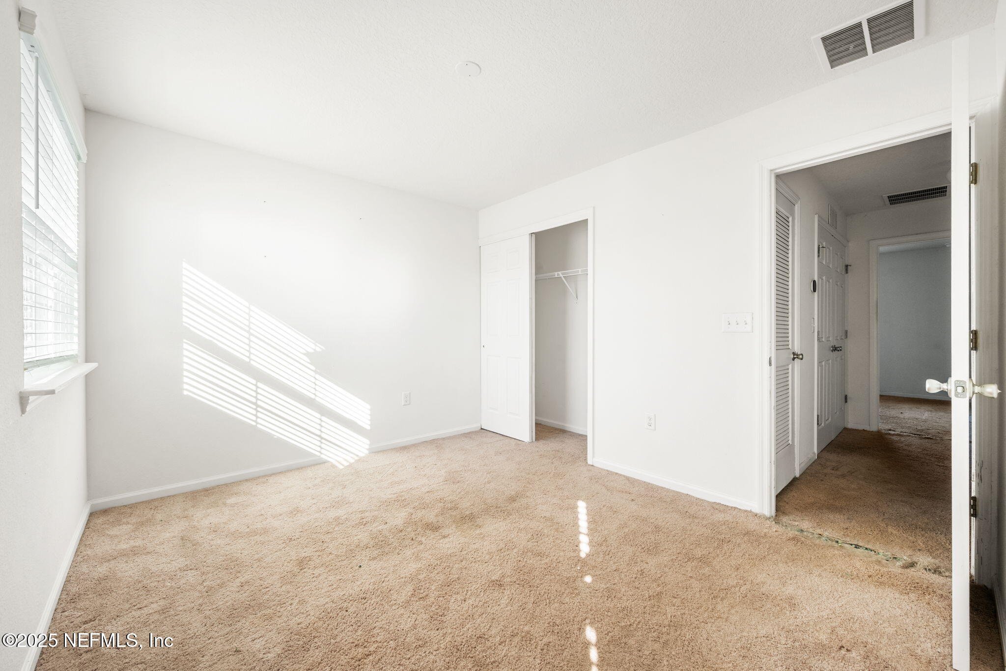 11799 Junegrass Road Jacksonville, FL 32258 - Photo 20 of 33 an empty room with windows