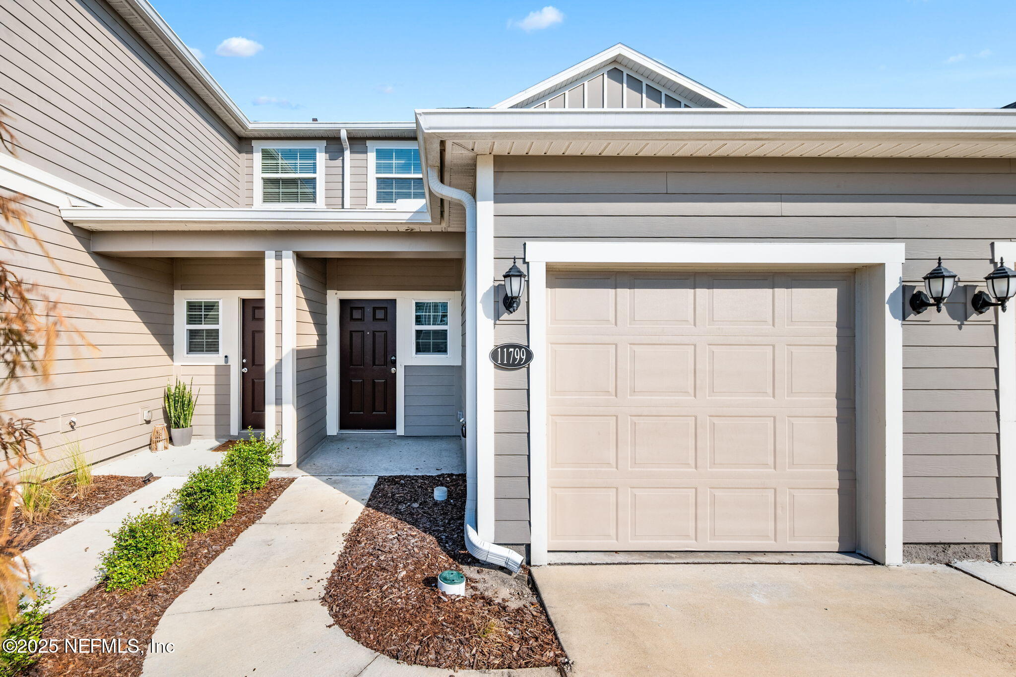11799 Junegrass Road Jacksonville, FL 32258 - Photo 2 of 33 a front view of a house with a garden