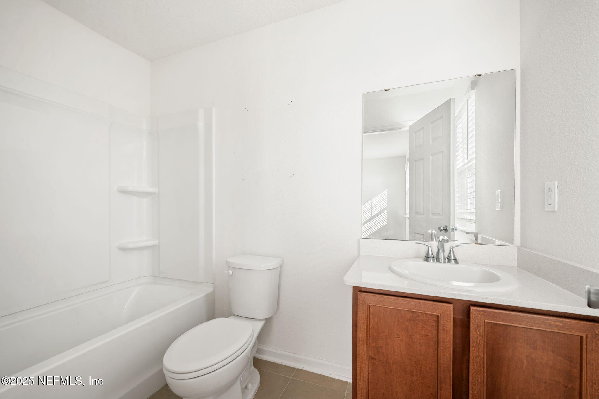 11799 Junegrass Road Jacksonville, FL 32258 - Photo 21 of 33 a bathroom with a sink a toilet and shower