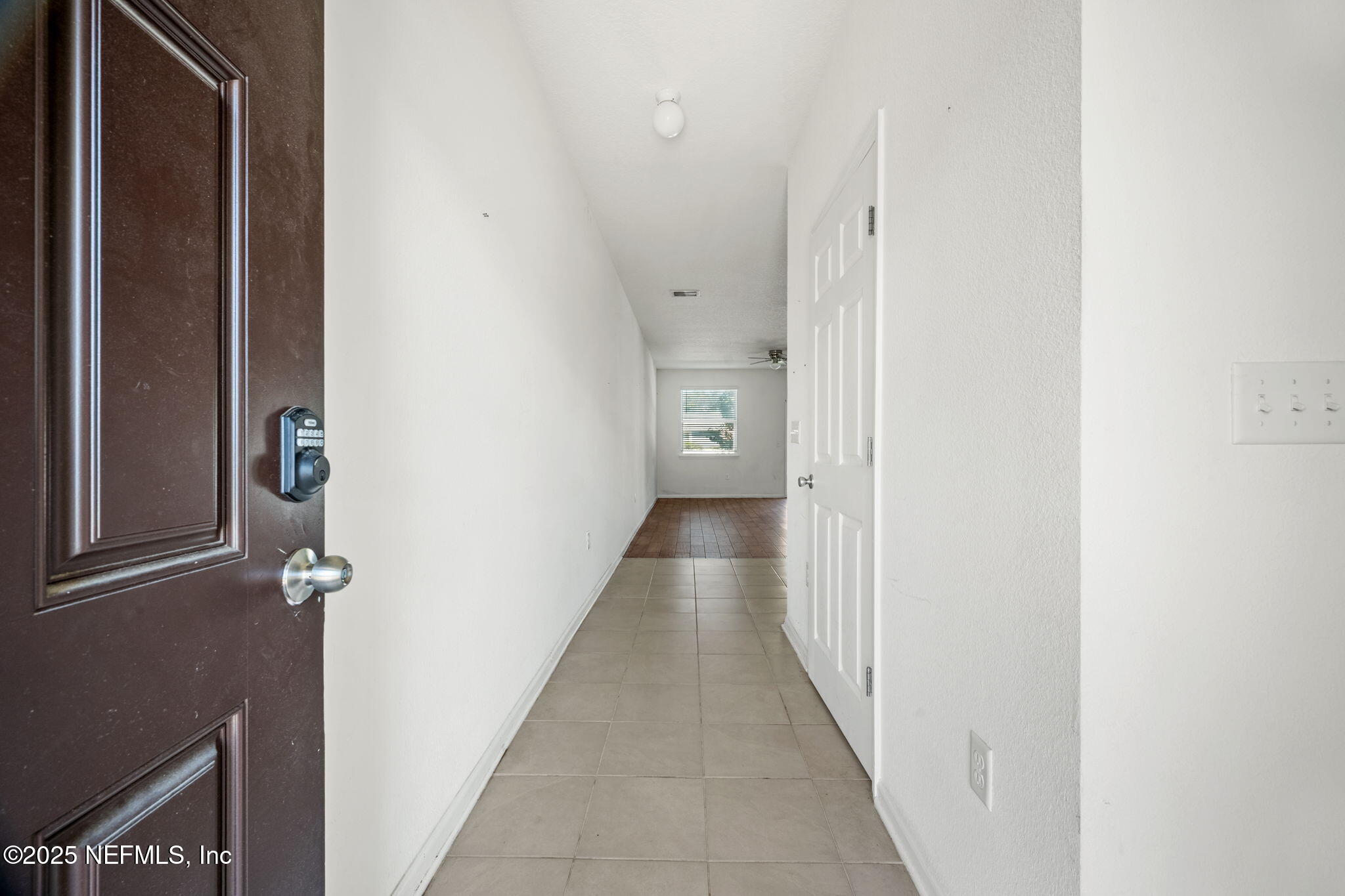 11799 Junegrass Road Jacksonville, FL 32258 - Photo 3 of 33 a view of a hallway