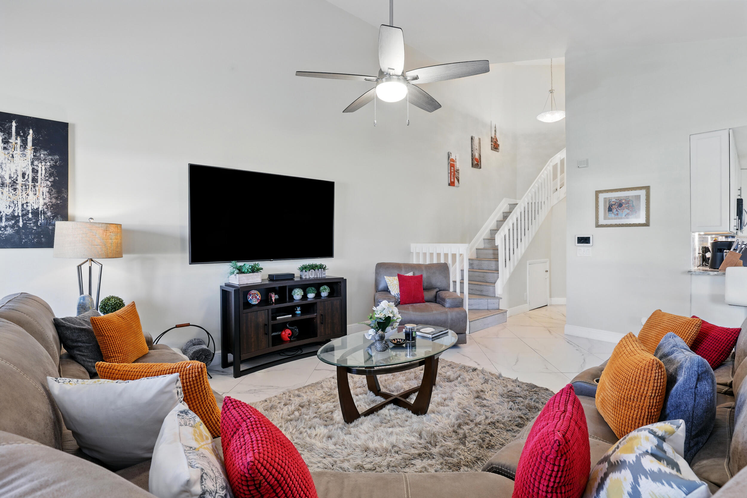 4491 Willow Pond Road, Unit B West Palm Beach, FL 33417 - Photo 13 of 29 a living room with furniture and a flat screen tv